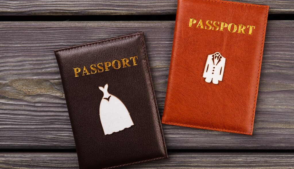 Passport jackets with the bride and groom emblems represent the issue of sponsorship for a K-1 fiancé